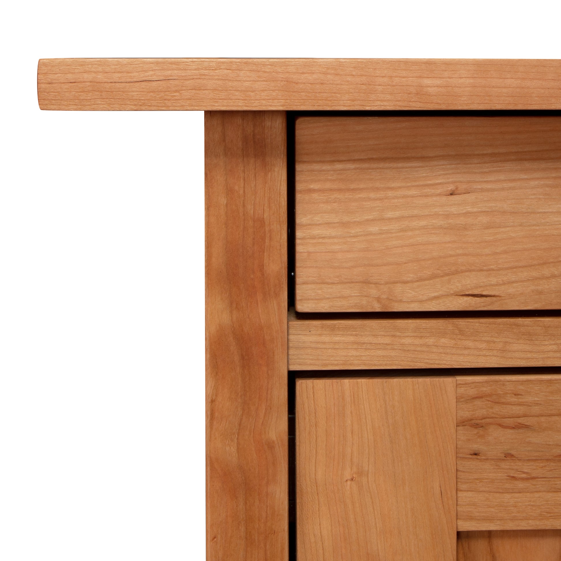 A close up of a wooden cabinet with the Vermont Furniture Designs Modern Craftsman 1-Drawer Nightstand with Door design.
