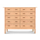 An eco-friendly Vermont Furniture Designs Modern Craftsman 10-Drawer Dresser with multiple drawers against a white background, offering ample bedroom storage.