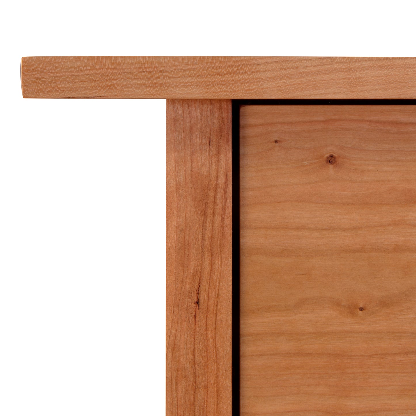 Close-up of a Vermont Furniture Designs Modern Craftsman 6-Drawer Dresser corner showing the texture and grain of the wood, against a white background.