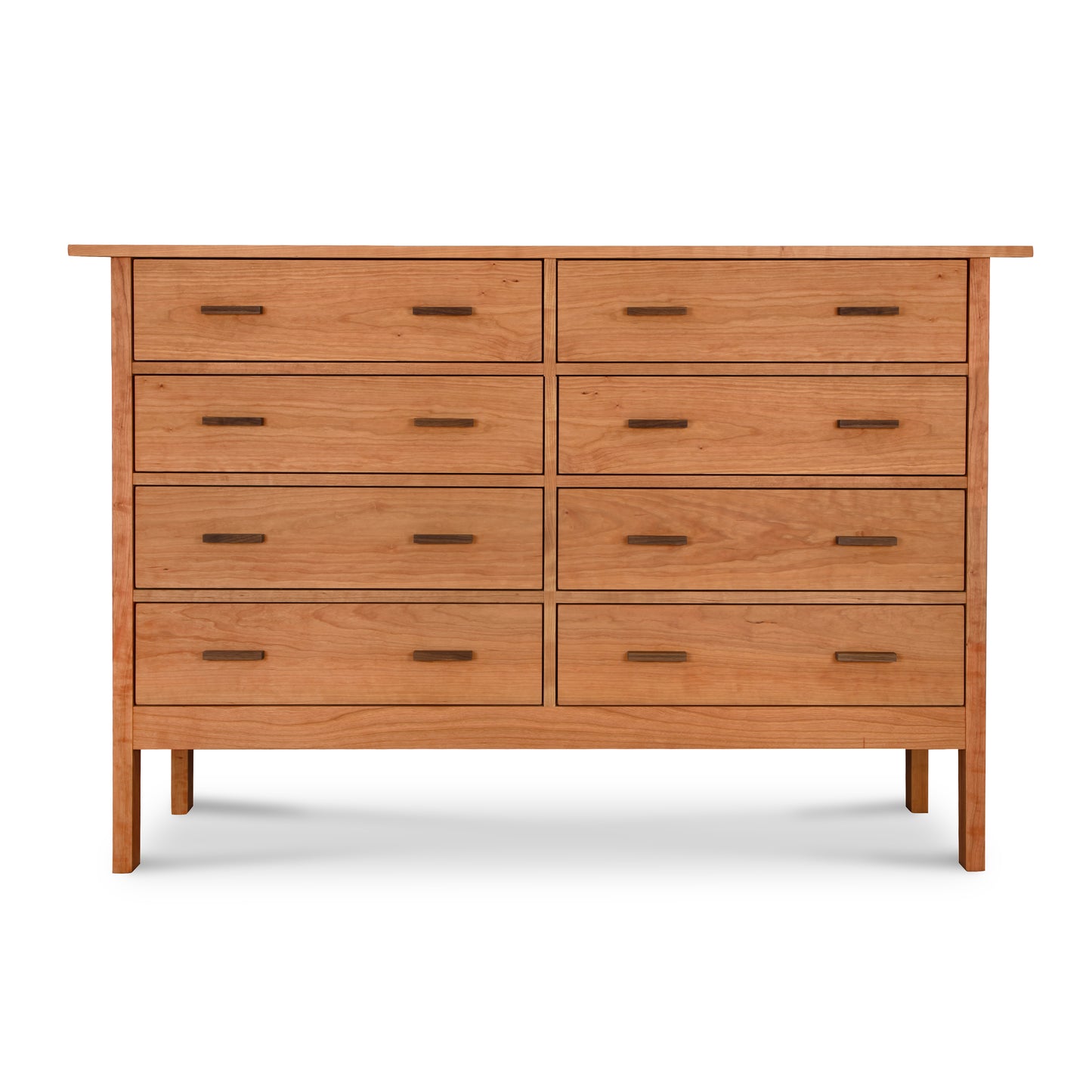 A Modern Craftsman 8-Drawer Dresser by Vermont Furniture Designs, featuring a minimalist design with natural Cherry wood and standing against a white background.