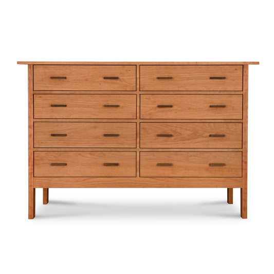 A Modern Craftsman 8-Drawer Dresser by Vermont Furniture Designs, featuring a minimalist design with natural Cherry wood and standing against a white background.