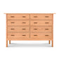 A Modern Craftsman 8-Drawer Dresser with nine drawers, crafted in natural cherry, isolated on a white background.