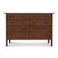 A Vermont Furniture Designs Modern Craftsman 8-Drawer Dresser made of natural cherry wood with multiple drawers against a white background.