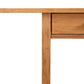 The sentence becomes: A handcrafted Modern Craftsman 2-Drawer Console Table with a simplistic design featuring two drawers, set against a white background by Vermont Furniture Designs.