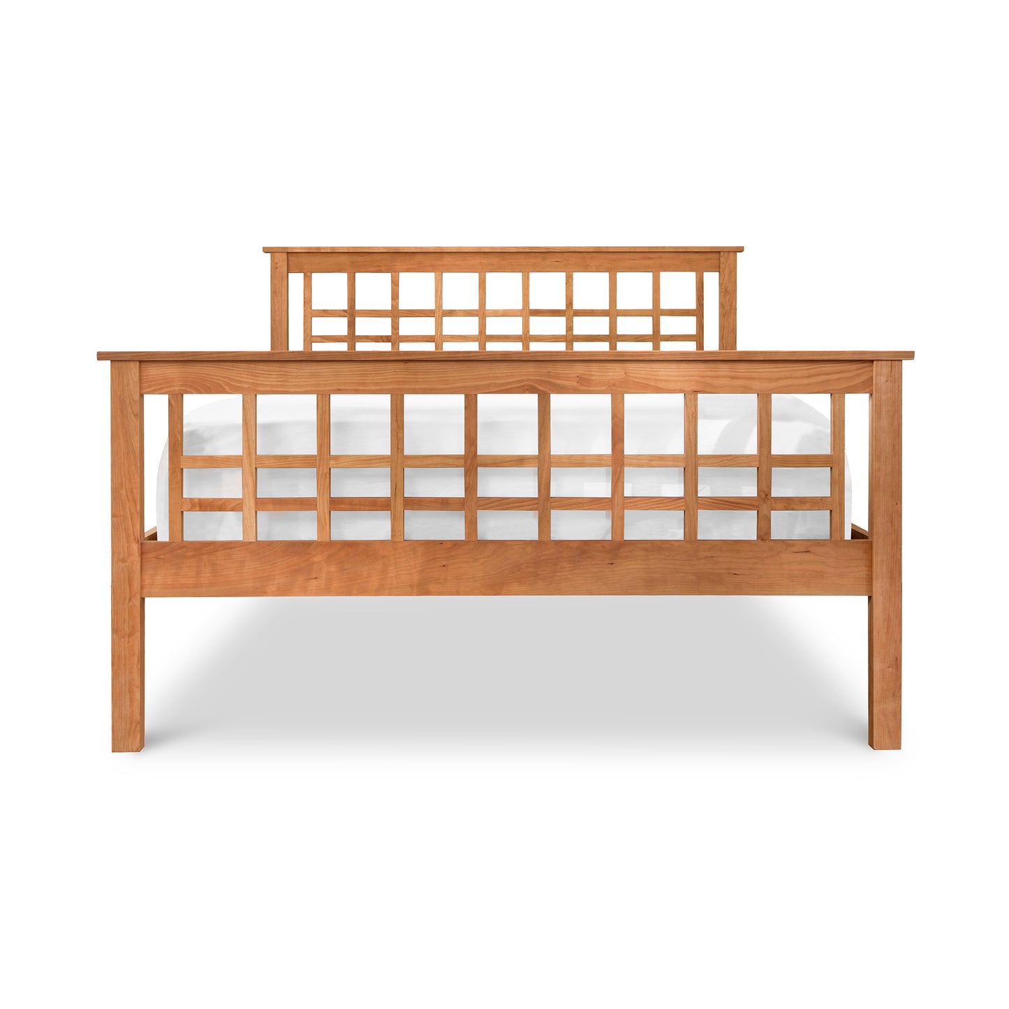 Modern Craftsman High Footboard Bed by Vermont Furniture Designs with a lattice headboard design, isolated on a white background.