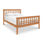 Vermont Furniture Designs Modern Craftsman High Footboard Bed with a lattice headboard and footboard, furnished with white bedding, isolated on a white background.
