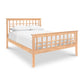 Modern Craftsman High Footboard Bed by Vermont Furniture Designs, featuring solid cherry wood frame with a slatted headboard and footboard, and white bedding on a white background.