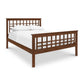 A Modern Craftsman High Footboard Bed from Vermont Furniture Designs, made from solid cherry maple walnut woods, features a square lattice headboard and footboard, furnished with plain white bedding, isolated on a white background.