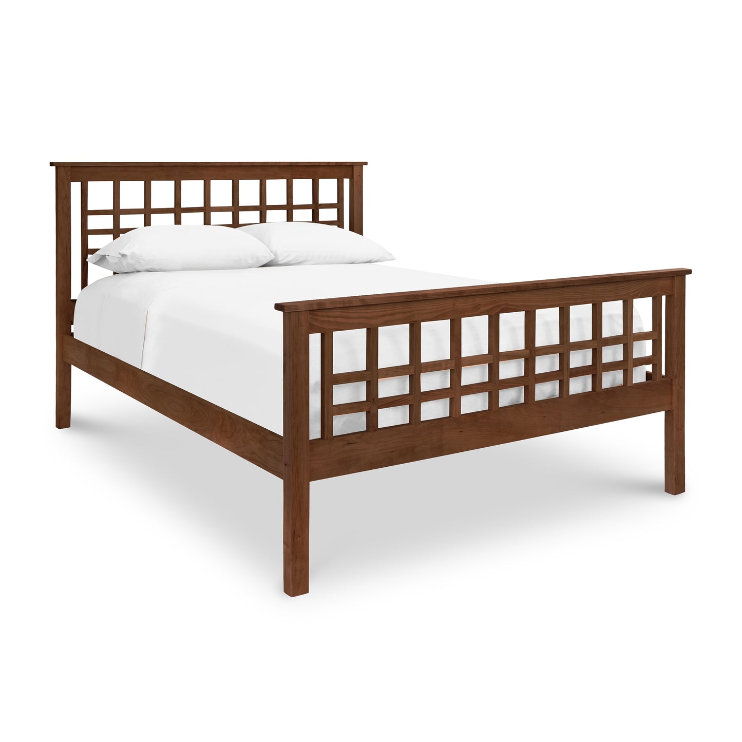 A Modern Craftsman High Footboard Bed with a modern Craftsman wooden frame and white sheets in a contemporary bedroom. (Brand Name: Vermont Furniture Designs)