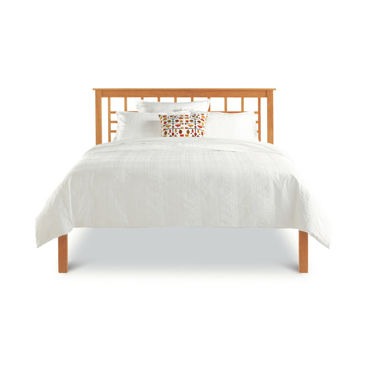 A Modern Craftsman Low Footboard Bed by Vermont Furniture Designs, featuring a solid wood bed with a wooden headboard and footboard.