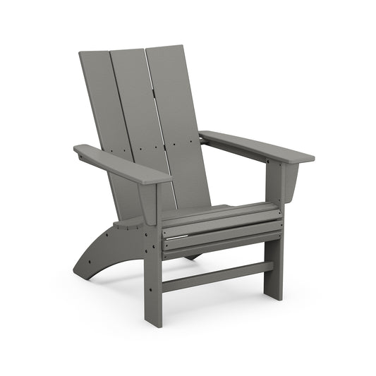 A gray POLYWOOD Modern Curveback Adirondack chair made of plastic, featuring a slatted back and seat with wide armrests, shown on a plain white background.