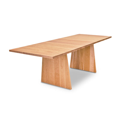 Lyndon Furniture Modern Designer Extension Table made of solid hardwood with a smooth top and distinctive angled wide legs.
