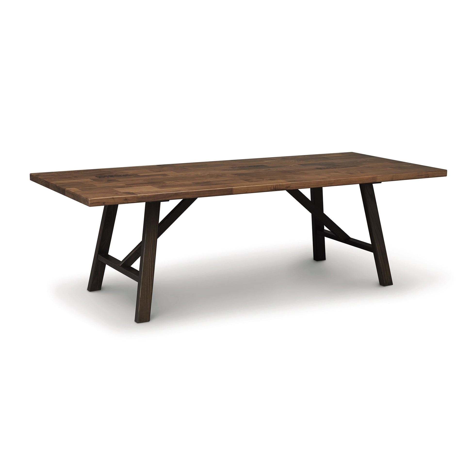 A Modern Farmhouse Trestle Farm Table with a plank-style top and x-shaped legs, crafted from natural cherry hardwood by Copeland Furniture, on a white background.