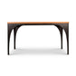 Modern Industrial Arched Table from Vermont Woods Studios with black metal legs and a hardwood top, expertly crafted in the USA.
