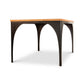Modern Industrial Arched Table by Vermont Woods Studios showcasing a rectangular wood top with black metal arched legs, American-made craftsmanship.