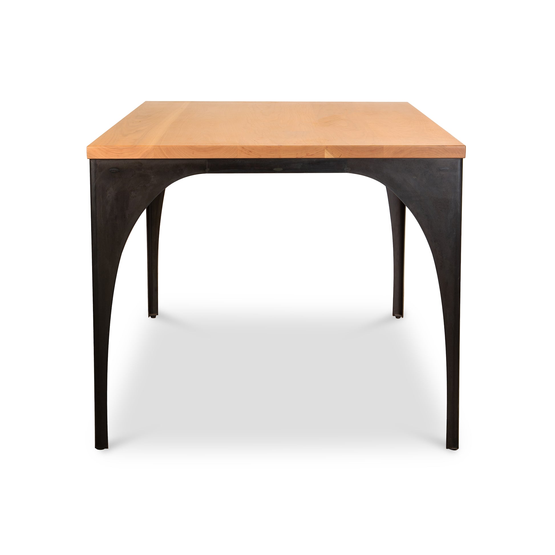 Vermont Woods Studios Modern Industrial Arched Table with light wood top and black metal legs, American made high quality furniture.