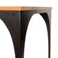 Close-up of the Modern Industrial Arched Table by Vermont Woods Studios, highlighting its American-made light wood top and black metal frame.