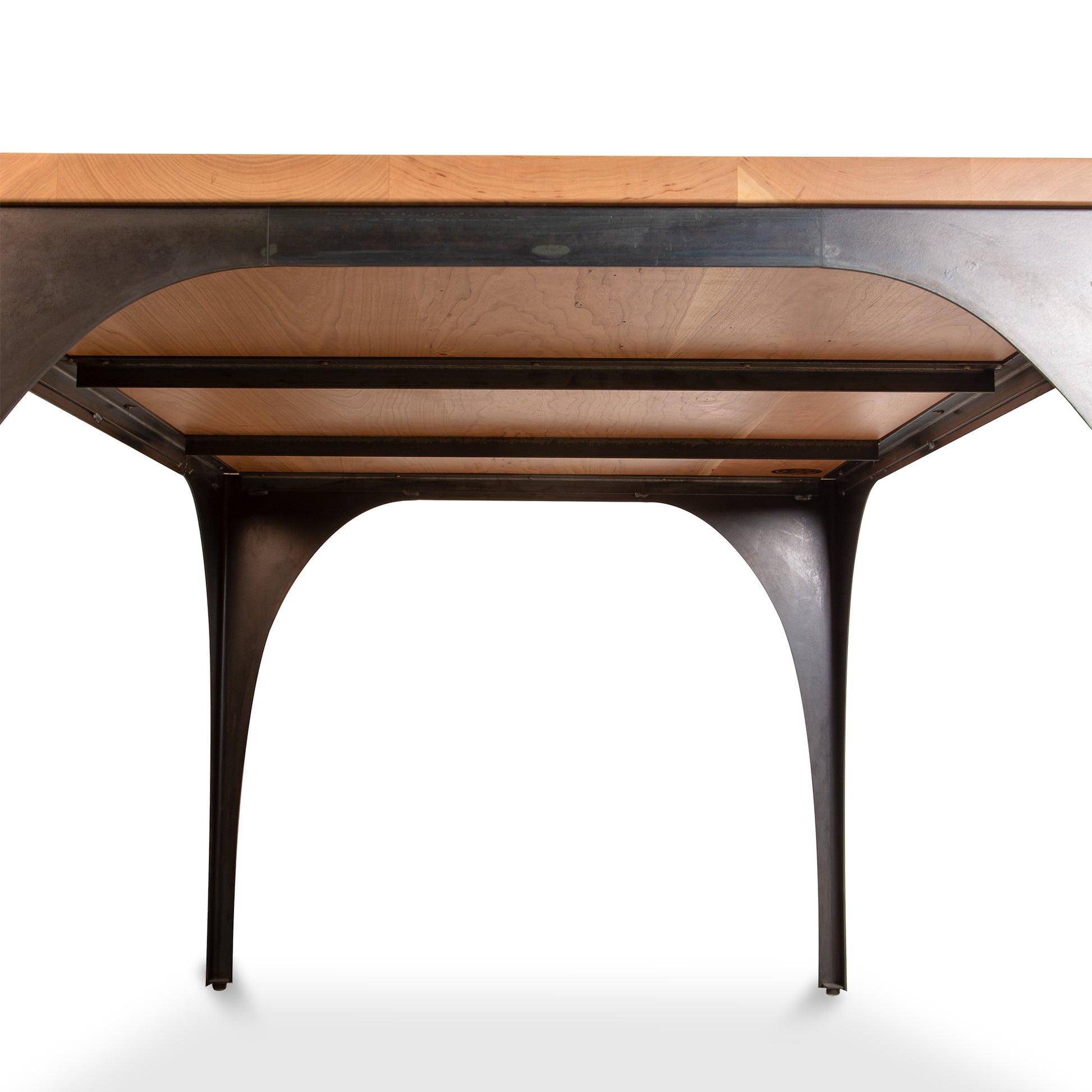 Modern Industrial Arched Table by Vermont Woods Studios featuring a rectangular hardwood top and striking black metal arched legs, handcrafted in the USA.