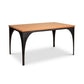 Modern Industrial Arched Table by Vermont Woods Studios with a light wood top and black steel legs, showcasing American craftsmanship.
