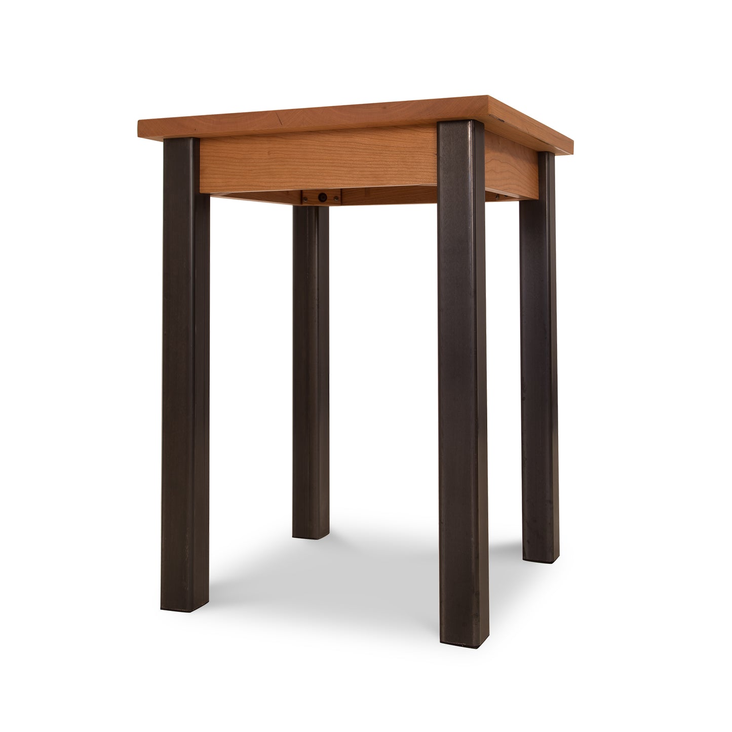 A Lyndon Furniture Contemporary Farmhouse End Table - Clearance with black legs and a wooden top.