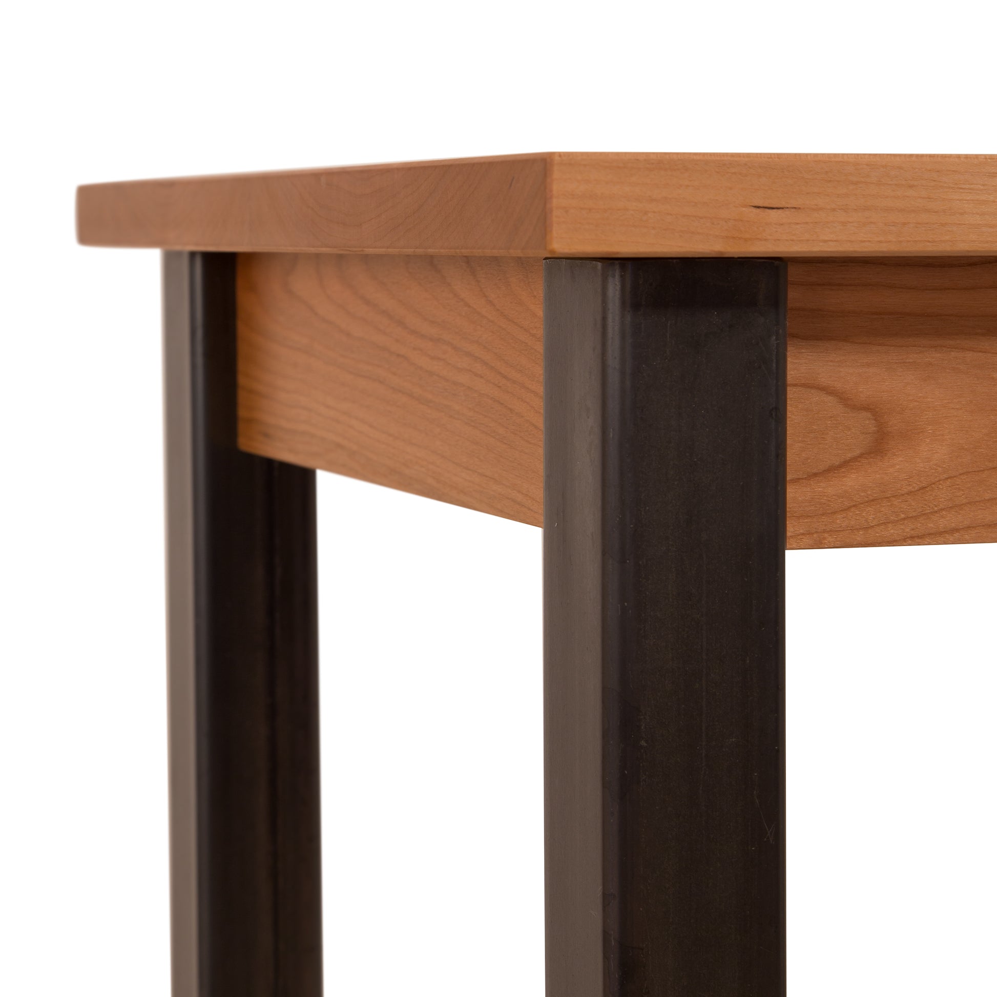 A Lyndon Furniture Contemporary Farmhouse End Table - Clearance with a wooden top and metal legs.