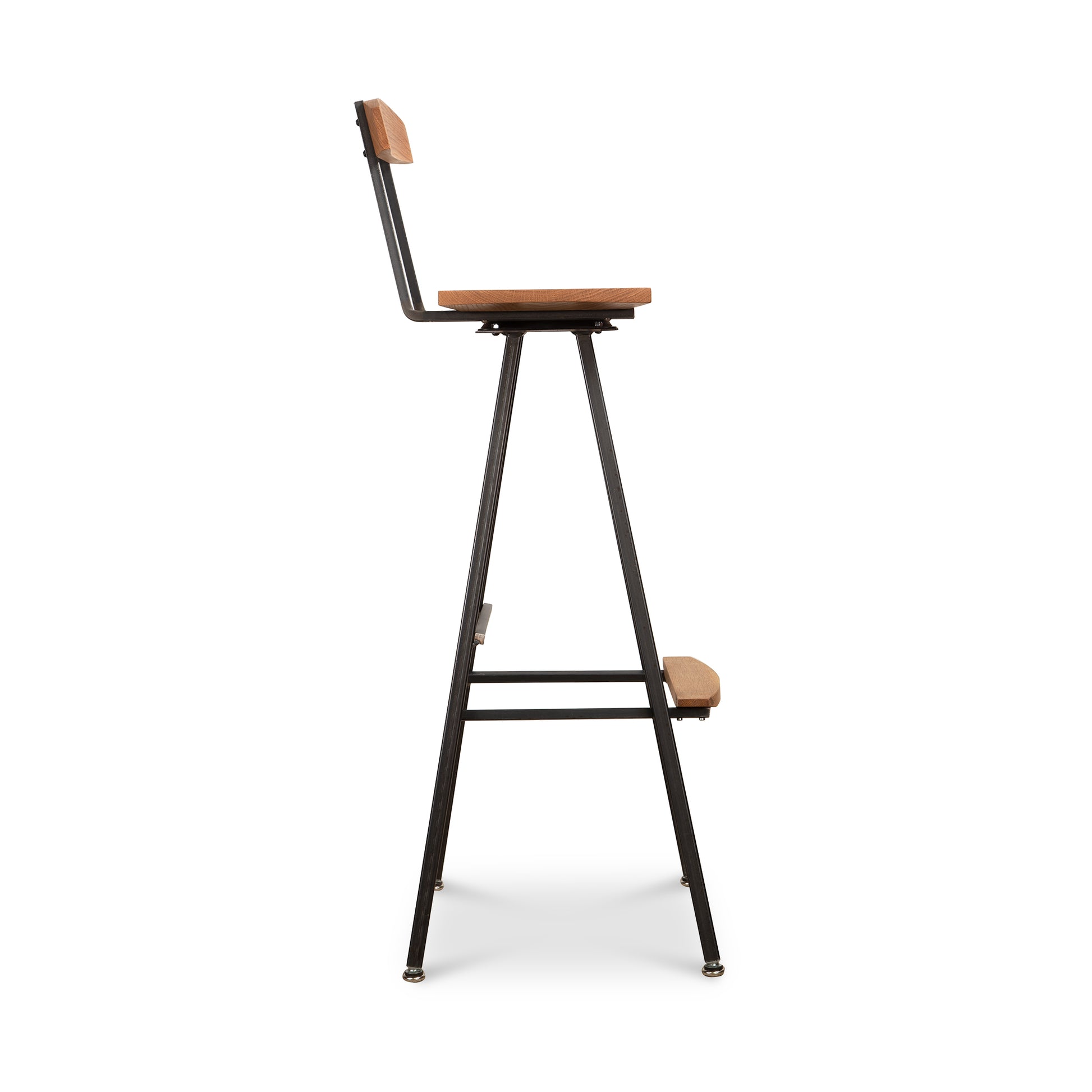 Modern Industrial Stool with Back by Vermont Woods Studios, featuring a sturdy metal frame, wood seat, low backrest, and integrated footrest.
