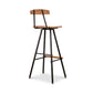 Modern Industrial Stool with a wooden seat and back, wood footrest, and sturdy black metal frame crafted by Vermont Woods Studios.