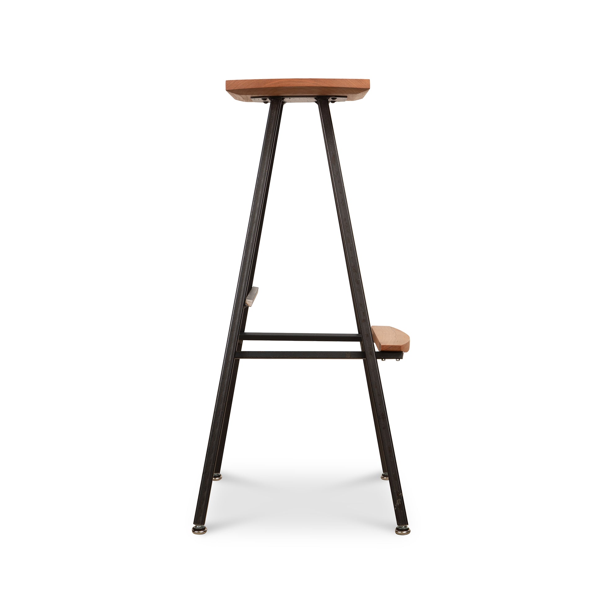 Modern Industrial Stool with a tall wooden seat, sturdy metal legs, and integrated footrest, crafted by Vermont Woods Studios.