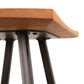 Modern Industrial Stool by Vermont Woods Studios featuring a curved wooden seat and sturdy black metal legs, highlighting its contemporary design and craftsmanship.