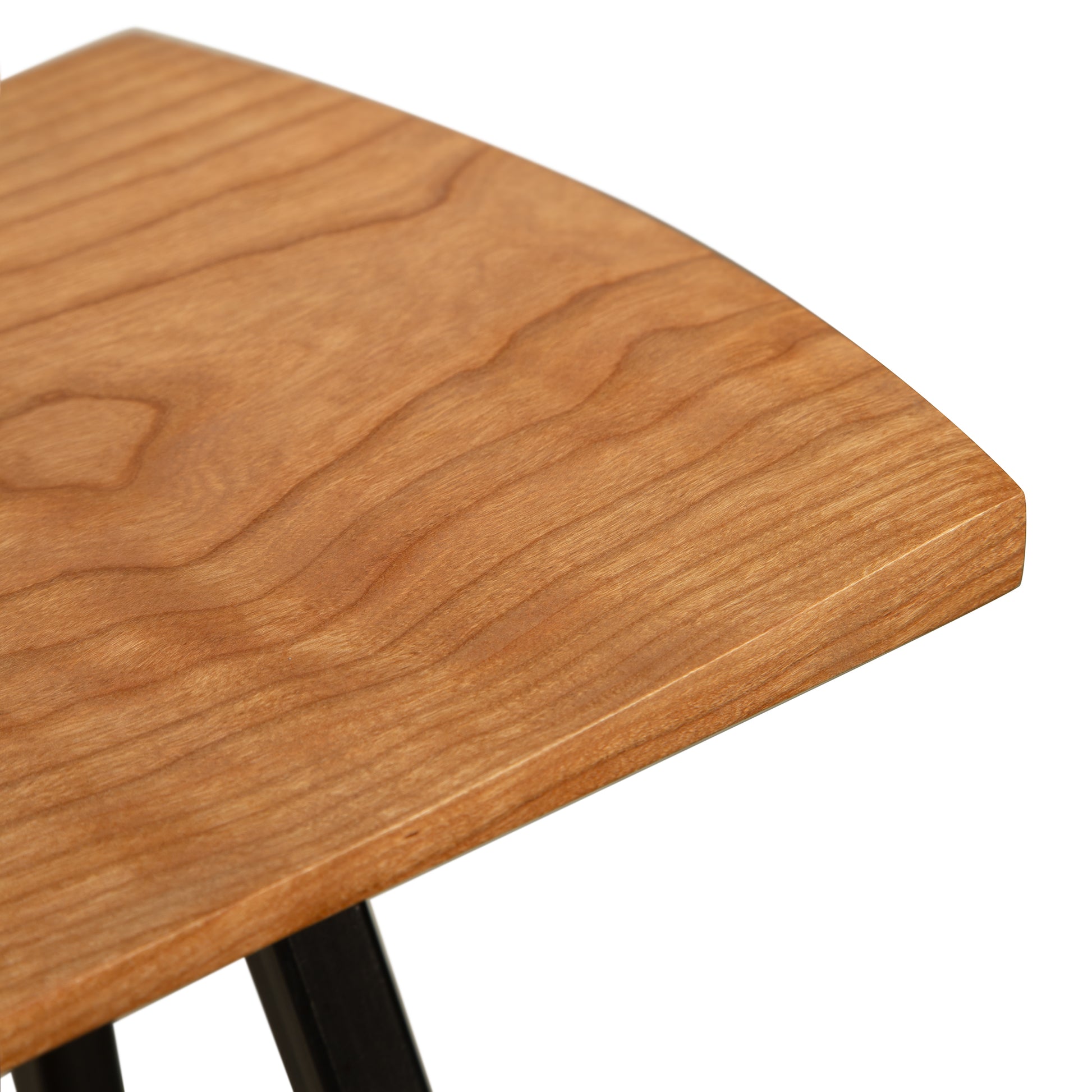 Modern Industrial Stool by Vermont Woods Studios featuring a wood seat with distinct grain and sturdy black metal legs, showcasing contemporary craftsmanship.