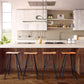 Set of Vermont Woods Studios Modern Industrial Stools with wooden seats and metal frames positioned around a kitchen island.