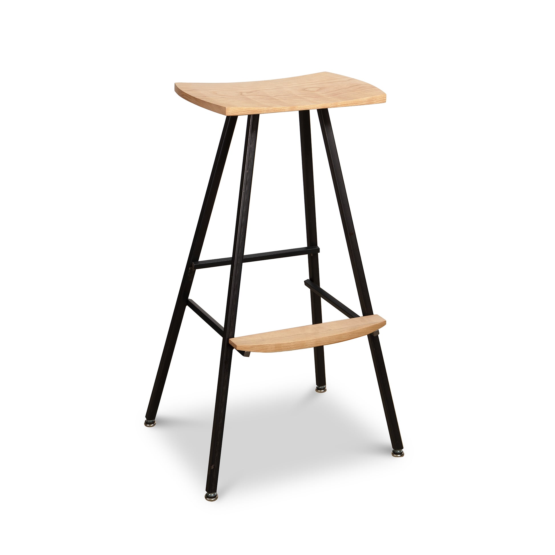 Modern Industrial Stool with a curved wooden seat, matching wood footrest, and sleek black metal legs handcrafted by Vermont Woods Studios.