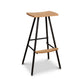 Modern Industrial Stool with a curved wood seat, sturdy black metal legs, footrest, and round feet, handcrafted by Vermont Woods Studios.