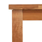 A close-up of the Modern Mission Parsons Extension Table by Lyndon Furniture, highlighting the seamless joinery at the corner where vertical and horizontal sections meet. This eco-friendly dining table features sustainably harvested solid wood with a smooth finish and natural grain pattern. The clean lines and minimalist design embody contemporary American-made furniture crafted in Vermont.