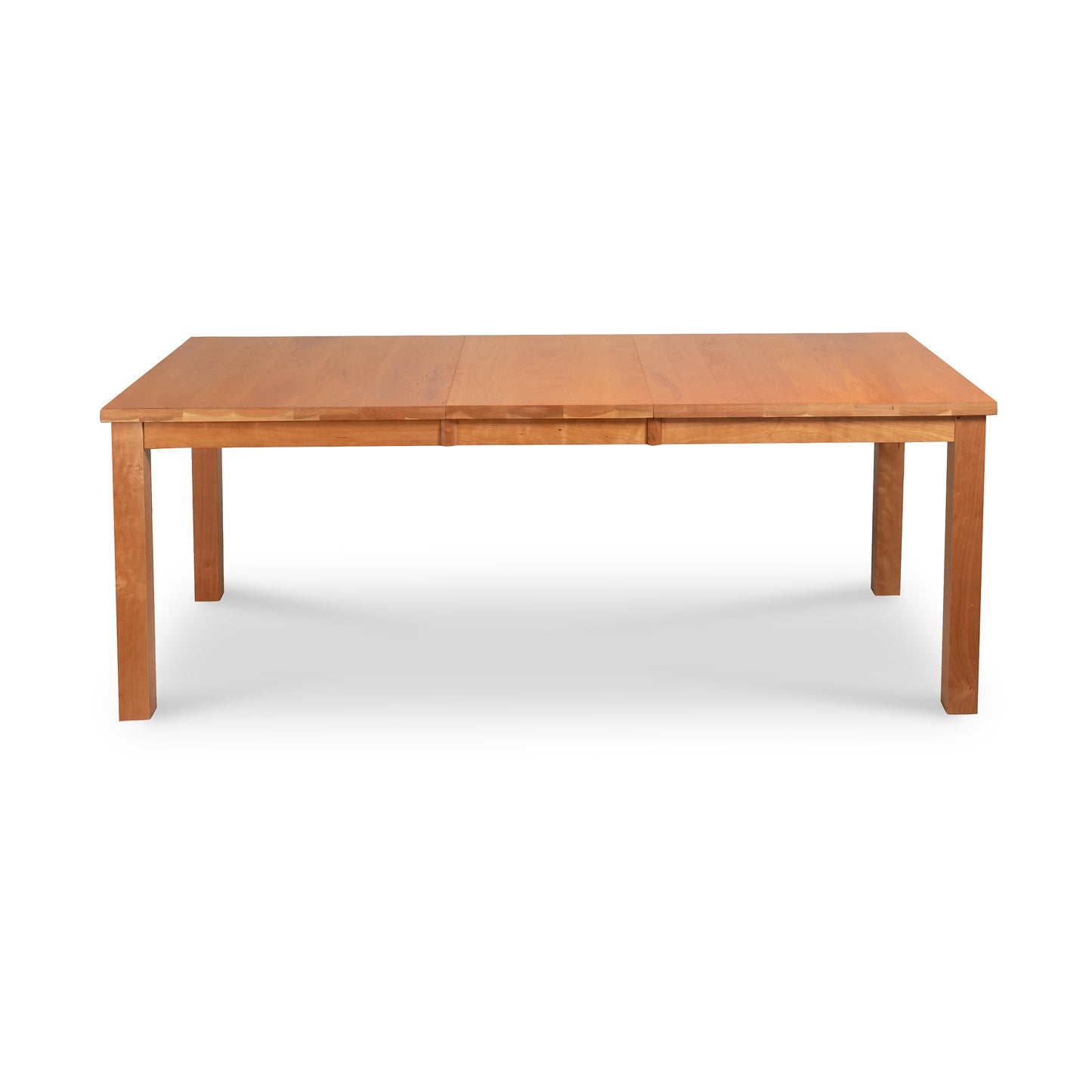 Modern Mission Parsons Extension Table by Lyndon Furniture in Light Brown Solid Wood - Rectangular Eco-Friendly Dining Table with Straight Legs, Sustainably Harvested Wood, Minimalist Design Against White Background.