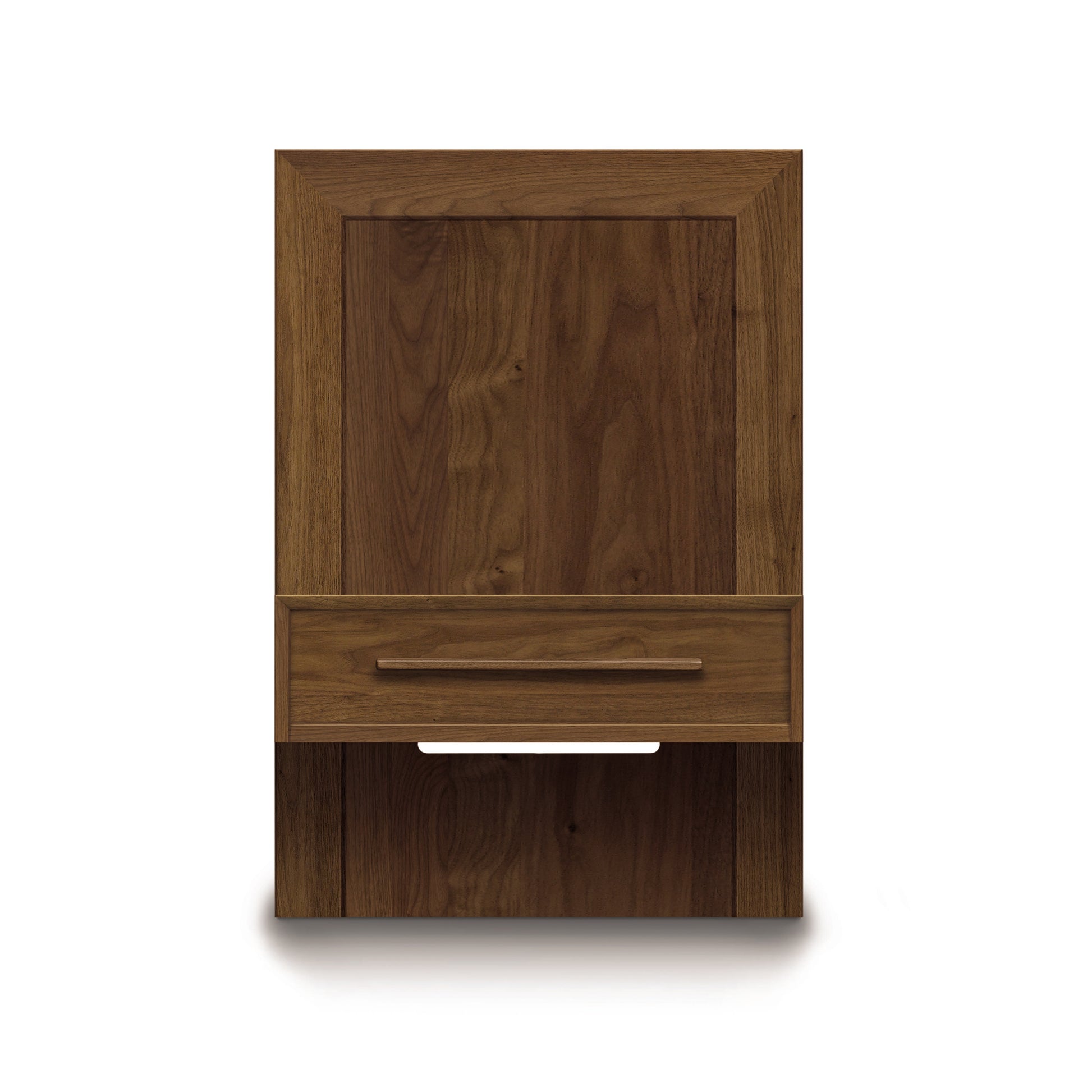 A wooden wall-mounted cabinet from the Copeland Furniture Moduluxe Attached Nightstand with Drawer - Storage Bed Series, featuring a single drawer. This cabinet showcases a natural wood grain finish and a long horizontal handle on the drawer. The front panel of the drawer has a recessed handle design, while the bottom part includes an open shelf.