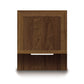 A wooden cabinet door with a metallic handle from the Copeland Furniture Moduluxe Attached Nightstand with Shelf - 29" Series viewed against a plain background.