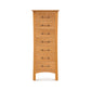 A tall, narrow cherry wood Monterey 7-Drawer Lingerie Chest from Copeland Furniture, featuring simple knobs and a curved bottom edge, stands against a white background.