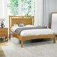 Copeland Furniture Monterey Platform Bed with grey and white bedding, complemented by a wooden nightstand.