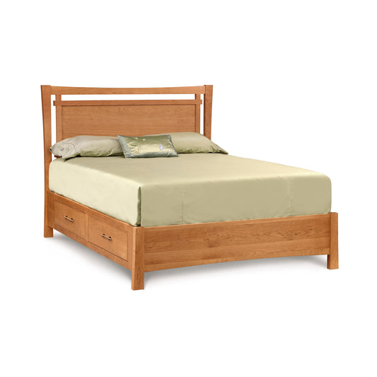 A Copeland Furniture Monterey Storage Bed with a headboard, furnished with a plain green bedsheet, two pillows, and a decorative cushion, set against a white background.
