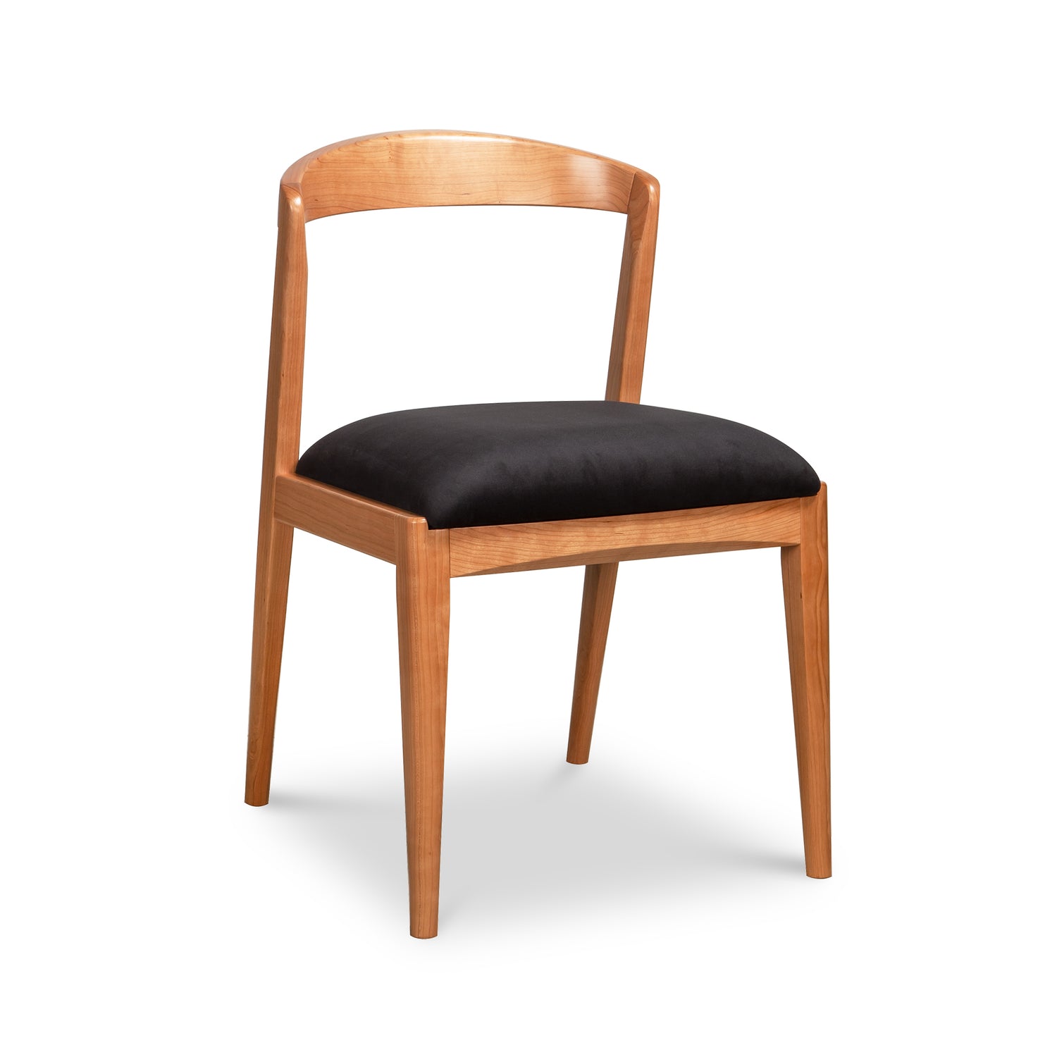 Montgomery Chair by Vermont Woods Studios, featuring natural cherry wood, a curved backrest, and black seat—expertly crafted American-made furniture.