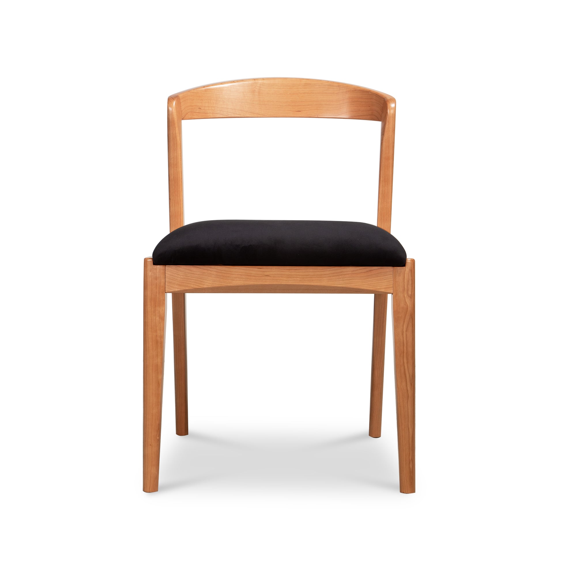 Montgomery Chair by Vermont Woods Studios with cherry frame, curved backrest, and black seat, crafted in America. High quality, modern wooden chair.