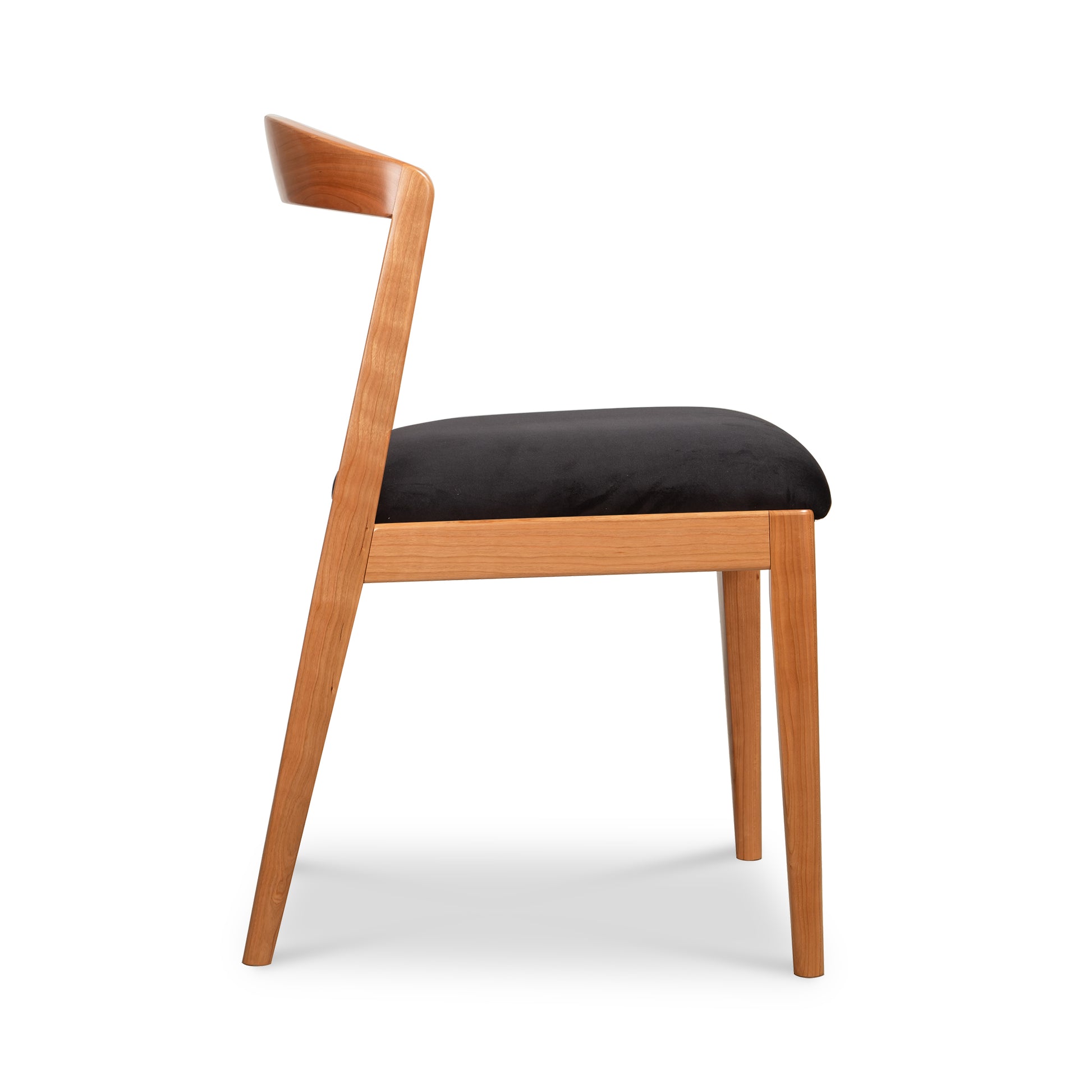 Montgomery Chair by Vermont Woods Studios featuring a curved back, cherry wood finish, and black upholstered seat, crafted in America.