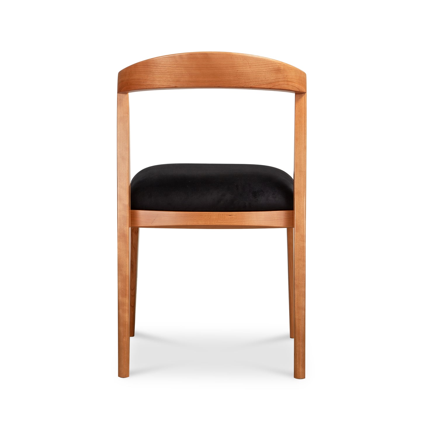 Montgomery Chair by Vermont Woods Studios featuring a cherry wood frame, curved back, and black seat, viewed from behind.
