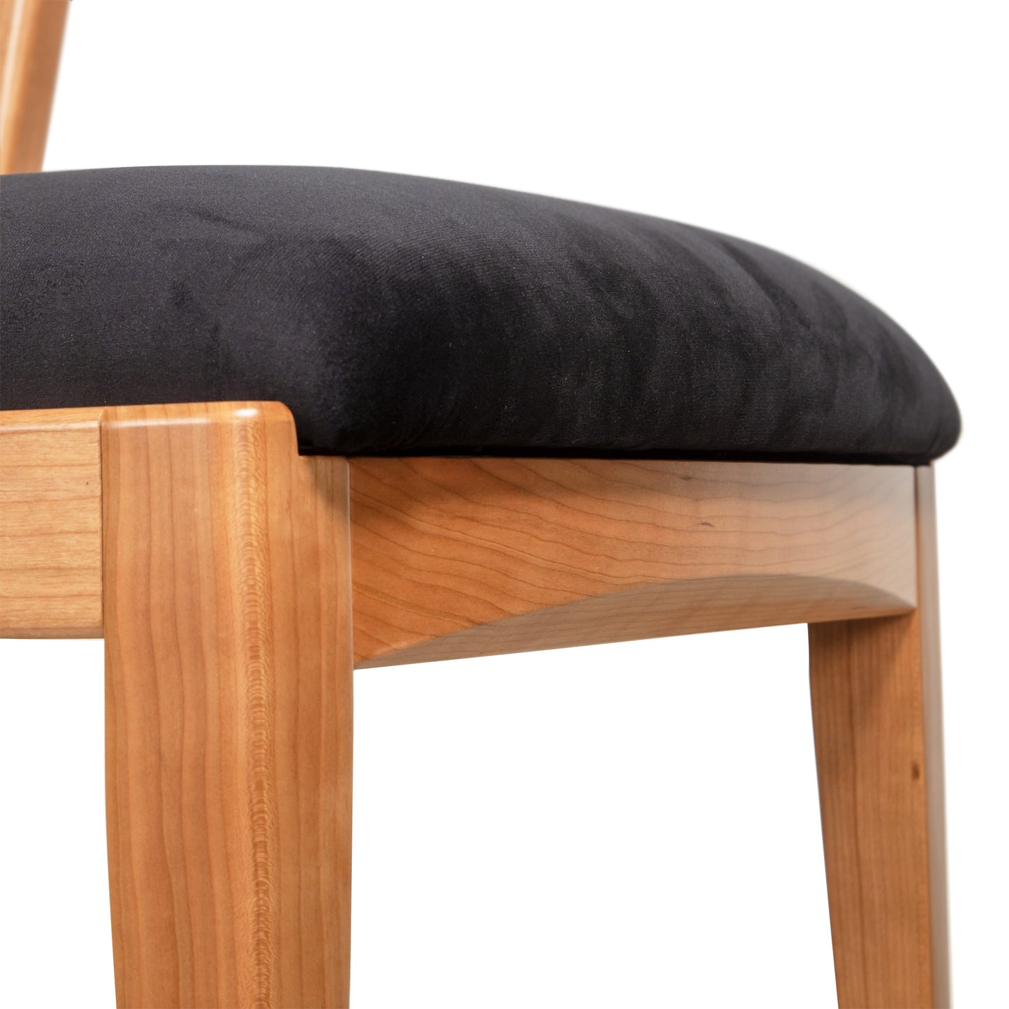 Vermont Woods Studios Montgomery Chair featuring natural cherry legs and a black seat, showcasing fine American craftsmanship.