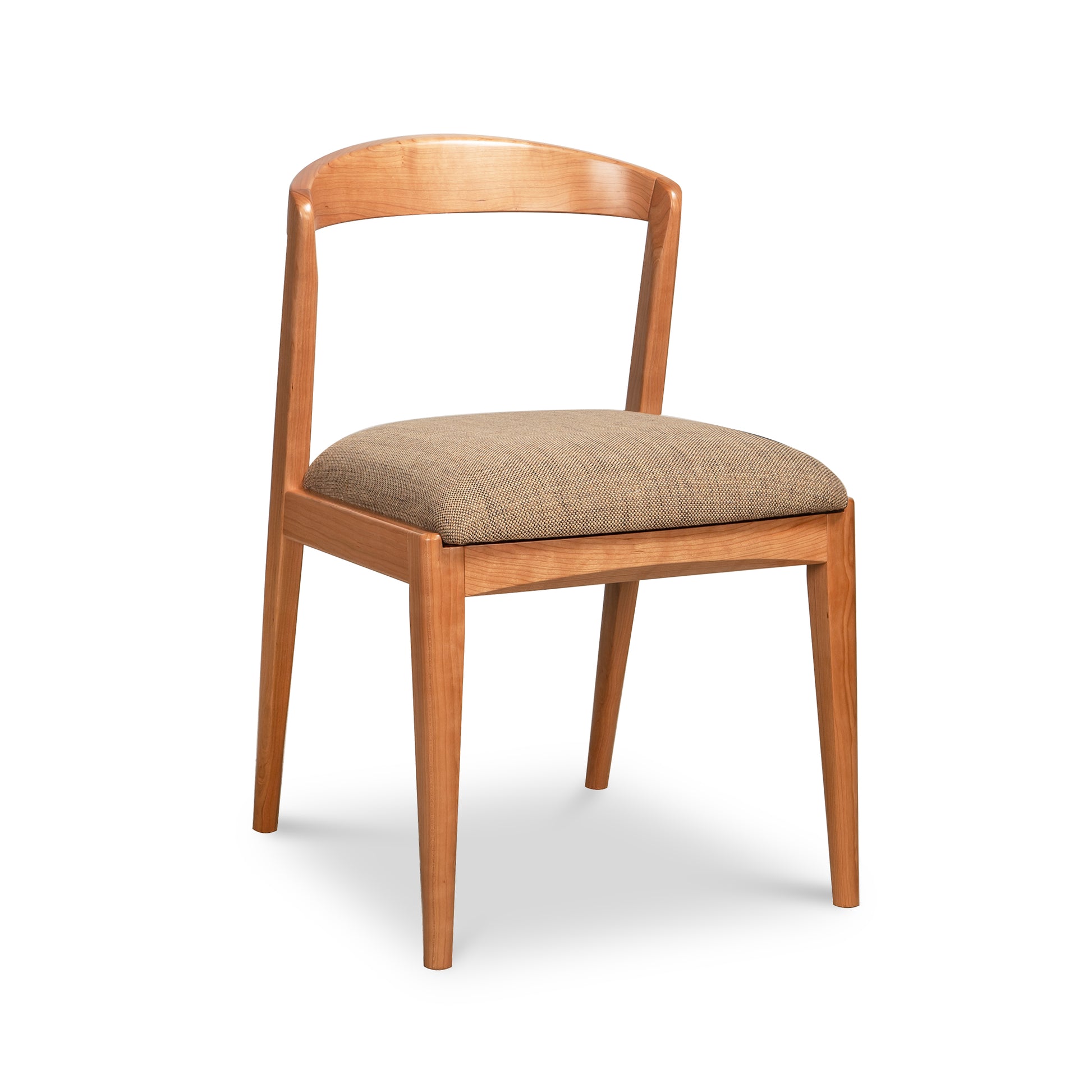 Montgomery Chair by Vermont Woods Studios with curved backrest, brown fabric seat, and natural cherry frame, American-made artisan quality.