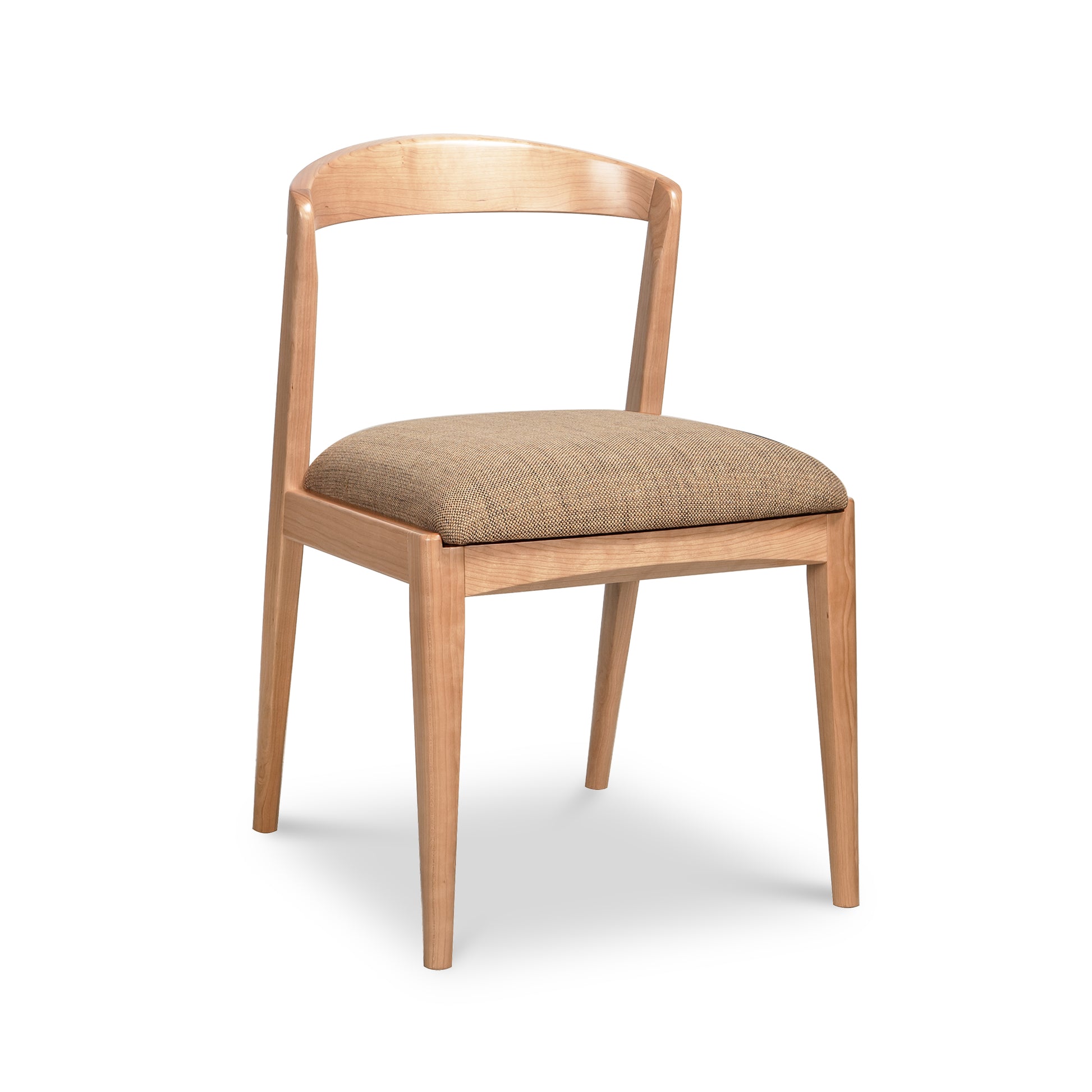 Montgomery Chair by Vermont Woods Studios, handcrafted in natural cherry with a curved back and brown seat, showcasing fine American craftsmanship.