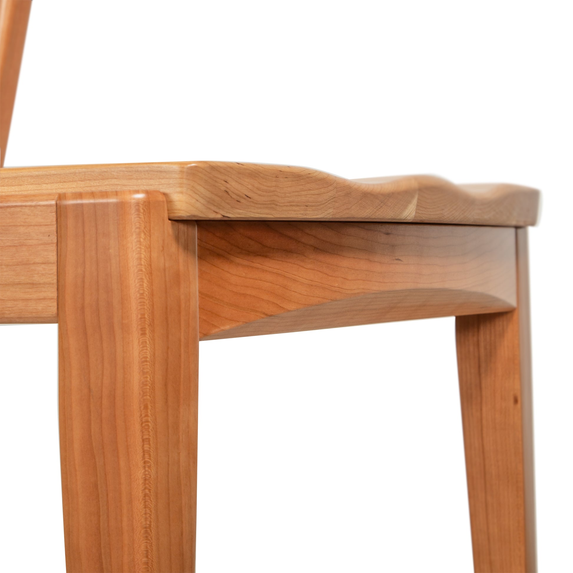 Vermont Woods Studios Montgomery Chair with a wood seat, showcasing elegant legs and sturdy light brown craftsmanship, American made.