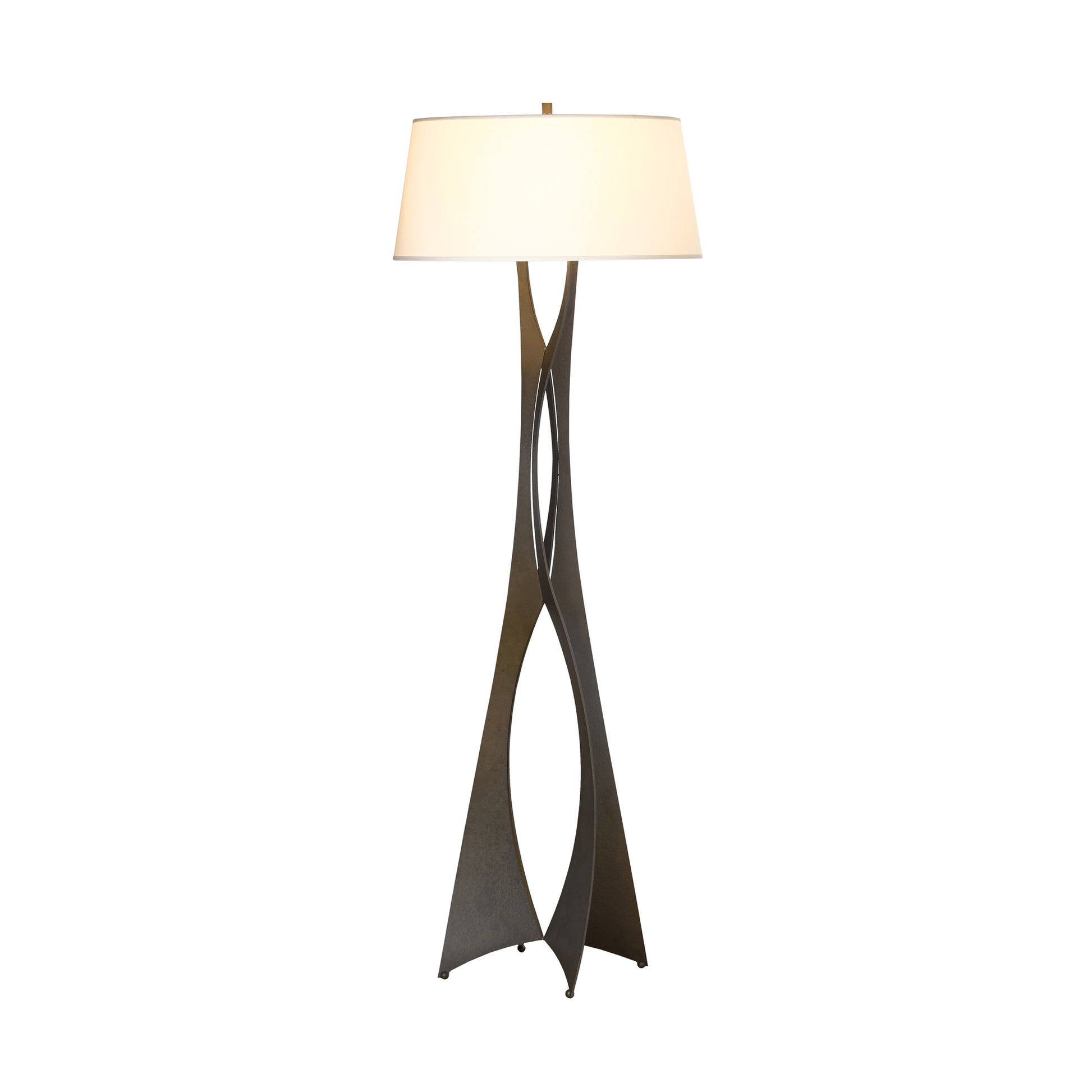 A modern Hubbardton Forge Moreau Floor Lamp with a slim, twisting metal finish base that intertwines upwards to support a broad, horizontal fabric shade. The lamp stands isolated against a white background.