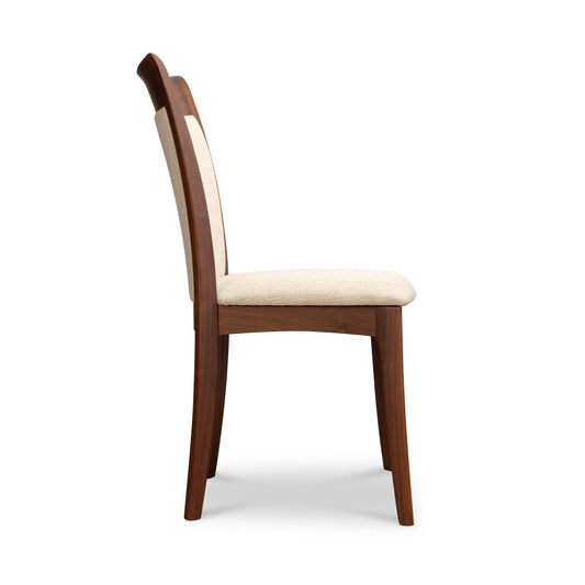 Copeland Furniture Morgan Shaker Chair in solid cherry, side view, featuring beige upholstered seat and back.